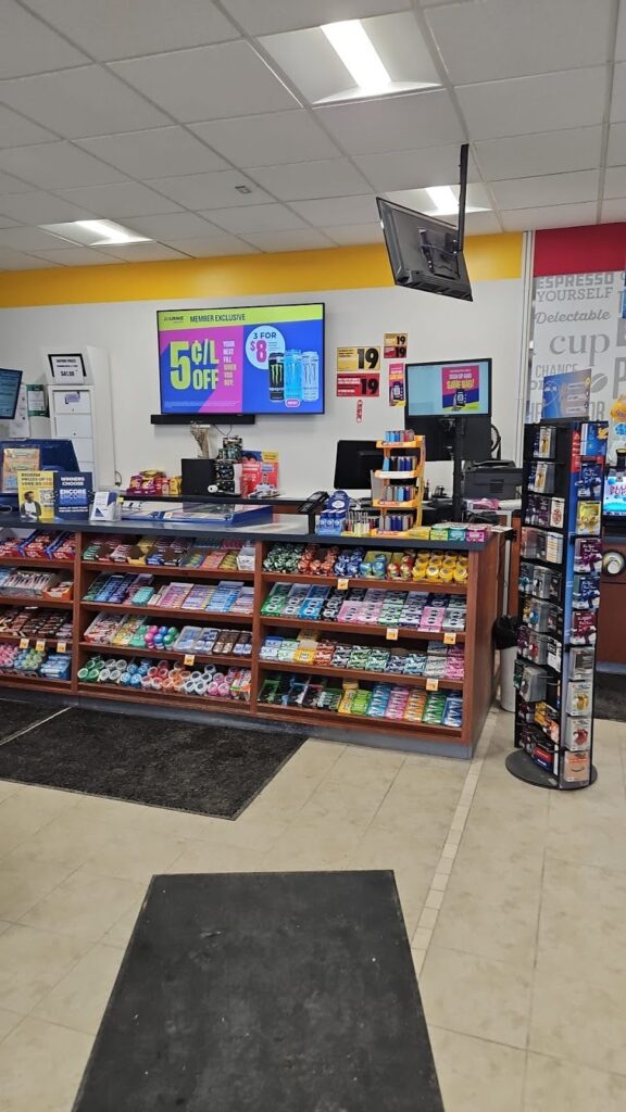 Infinity Mart Kawartha Lakes convenience store interior checkout counter snacks candy cold beverages Ontario.